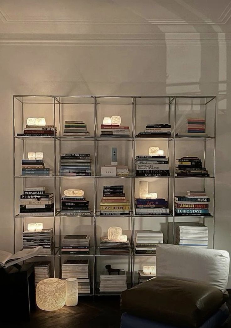 a living room filled with furniture and lots of books