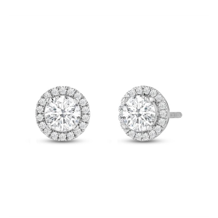 Classic round cut earrings with a stunning halo of round stones encircling the center stone.A lovely outfit-maker, this pair of stud earrings is what you need to give any ensemble a polished, put-together finish. Fine Jewelry Cubic Zirconia Round Cluster Earrings, Elegant Round Cut Cluster Earrings With Halo Setting, Formal Halo Cluster Earrings Fine Jewelry, Formal Halo Cluster Earrings, Round Lab Grown Diamond Jewelry With Halo, Elegant Round Cut Halo Cluster Earrings, Round Lab-grown Diamond Jewelry With Halo, Lab Grown Diamond Halo Jewelry, Halo Round Lab Grown Diamond Jewelry