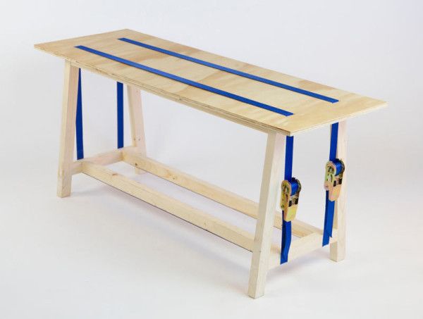 a wooden bench with blue straps on it