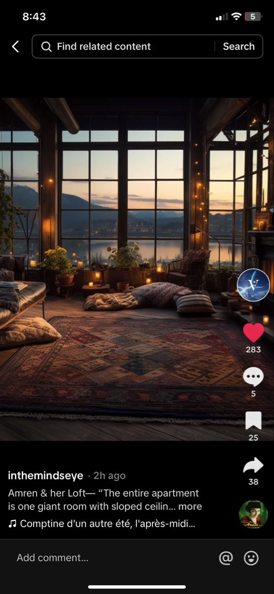 an image of a living room with windows and pillows on the floor in front of it