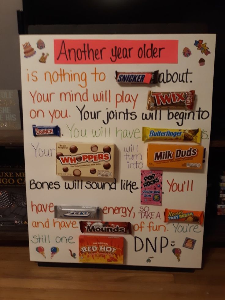 a sign with candy bars on it that says another year older is nothing to do