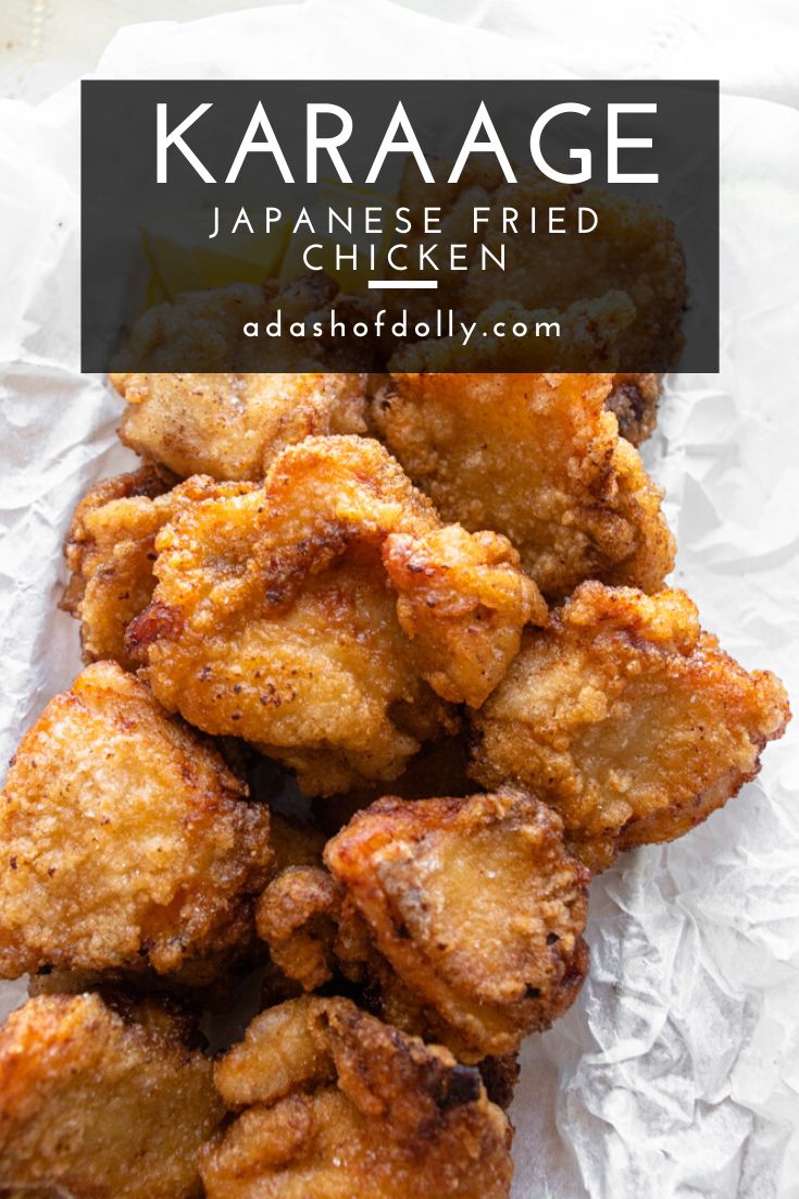 some fried chicken sitting on top of paper with the words karaage japanese fried chicken above it