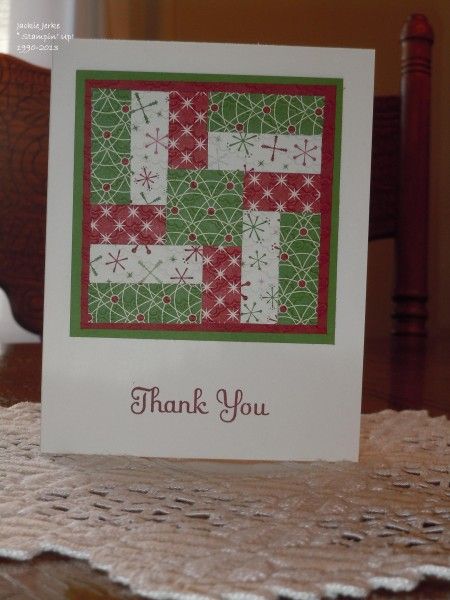 a thank you card sitting on top of a table next to a white doily