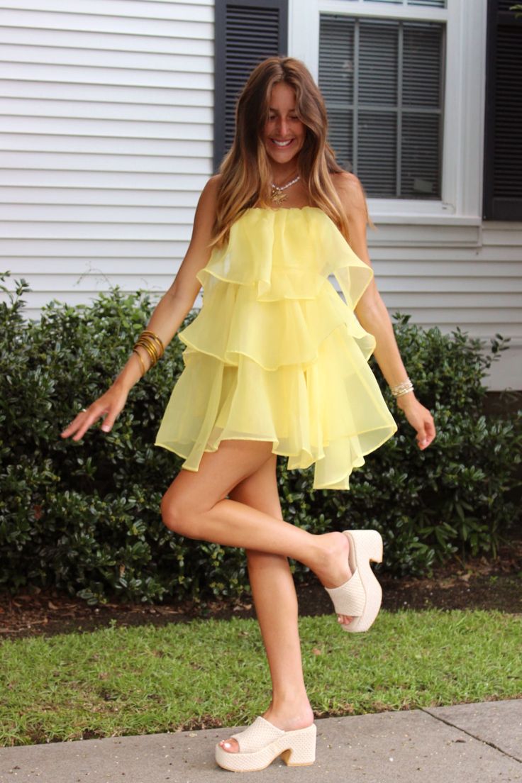 Yellow strapless mini dress with an open back, ruffle tiers, and a shiny sheer material! Model is a 2/4 wearing a small! Athleisure Dress, Cocktail Dress Formal, Summer Bikinis, Sheer Material, Strapless Mini Dress, Romper Pants, Open Back, Sweater Top, Unique Style