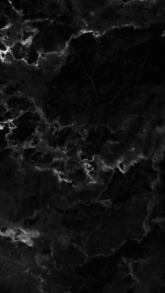 a black marble textured background that is very dark