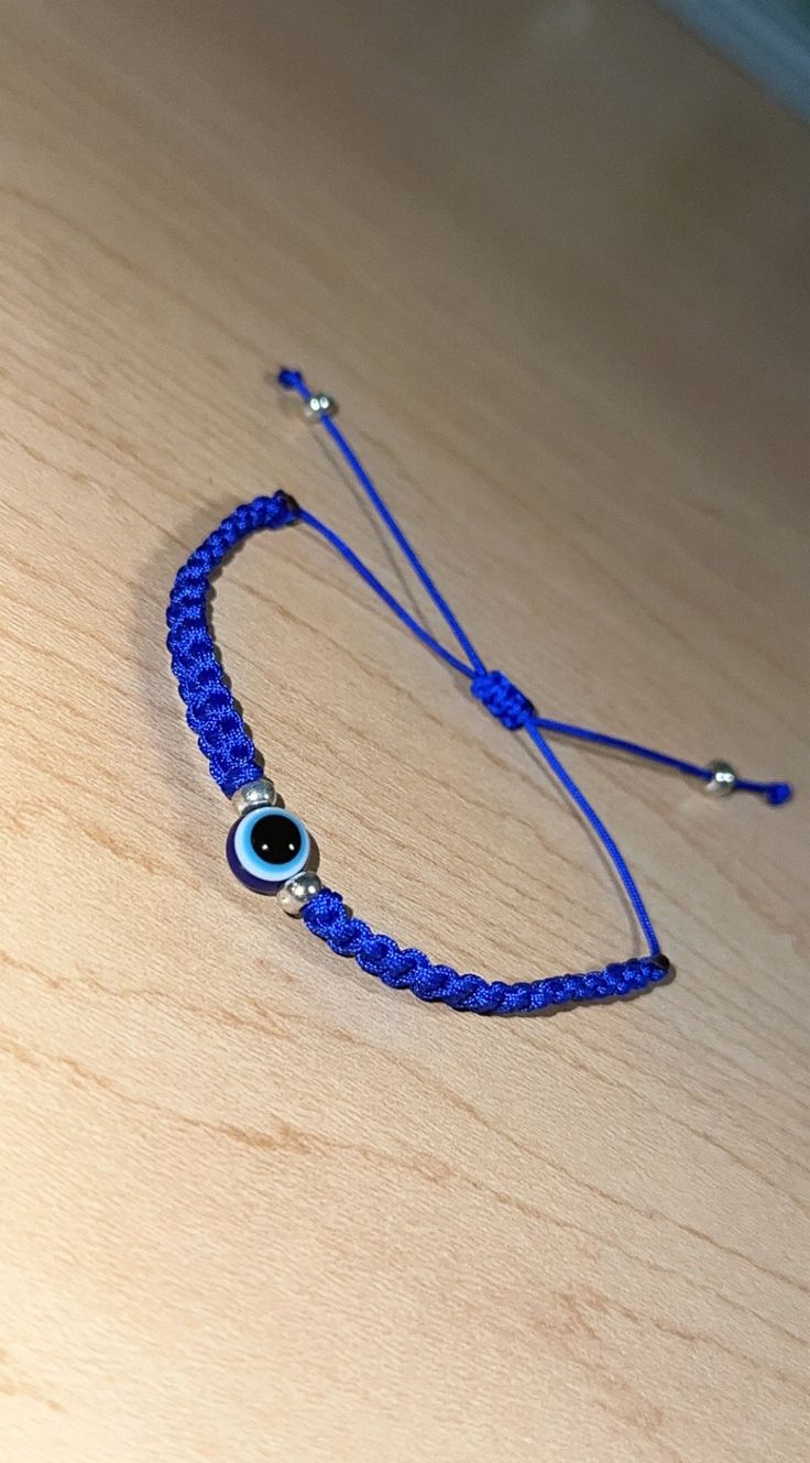 Handmade simple blue evil eye bracelet. Adjustable Blue Friendship Bracelets With Evil Eye, Casual Blue Friendship Bracelets With Evil Eye, Blue Evil Eye Round Beaded Bracelets, Adjustable Blue Beaded Bracelets With Evil Eye, Adjustable Blue Evil Eye Beaded Bracelets, Evil Eye Bracelet For Everyday Wear, Adjustable Blue Beaded Evil Eye Bracelets, Adjustable Round Evil Eye Bracelet, Blue Adjustable Evil Eye Bracelet