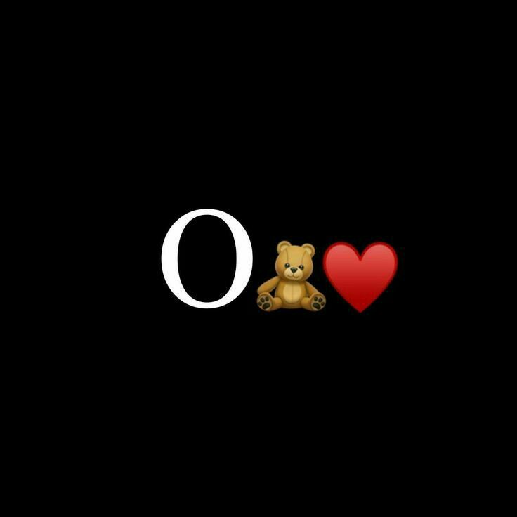 a teddy bear sitting next to the word o with a heart on it's chest