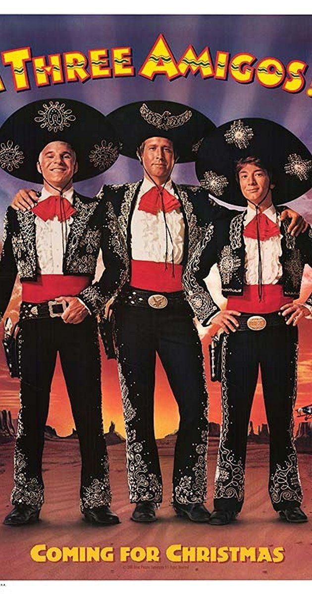 the three amigoses are standing in front of an advertisement