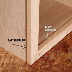 a close up of a wooden shelf with measurements for the top and bottom section on it