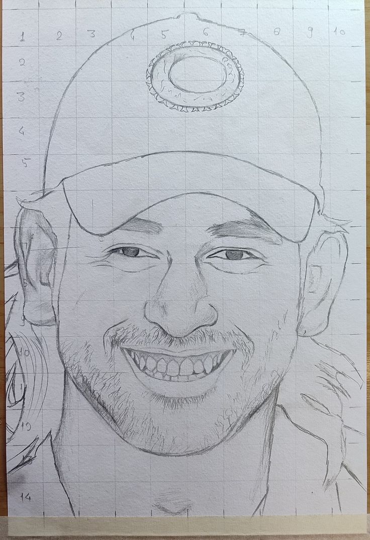 a drawing of a man's face with a baseball cap on top of it