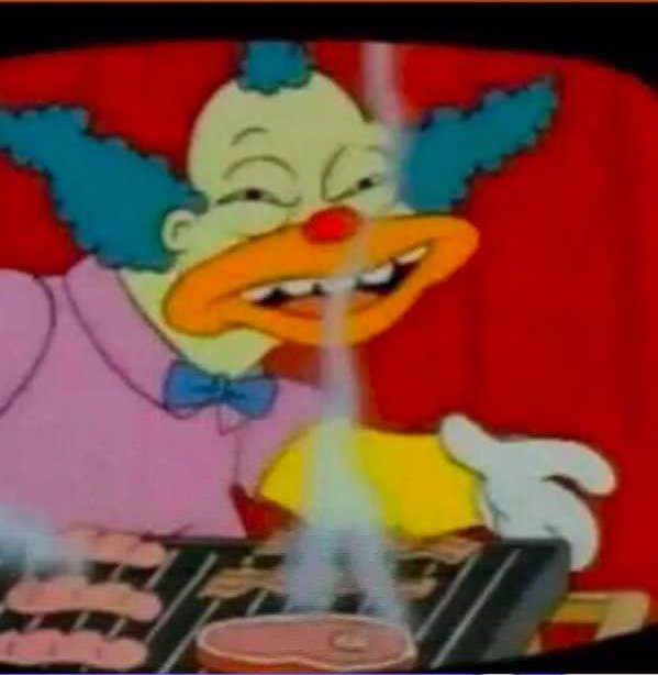 an animated image of a clown playing the keyboard