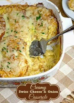 a casserole dish with cheese and onion in it on a checkered table cloth