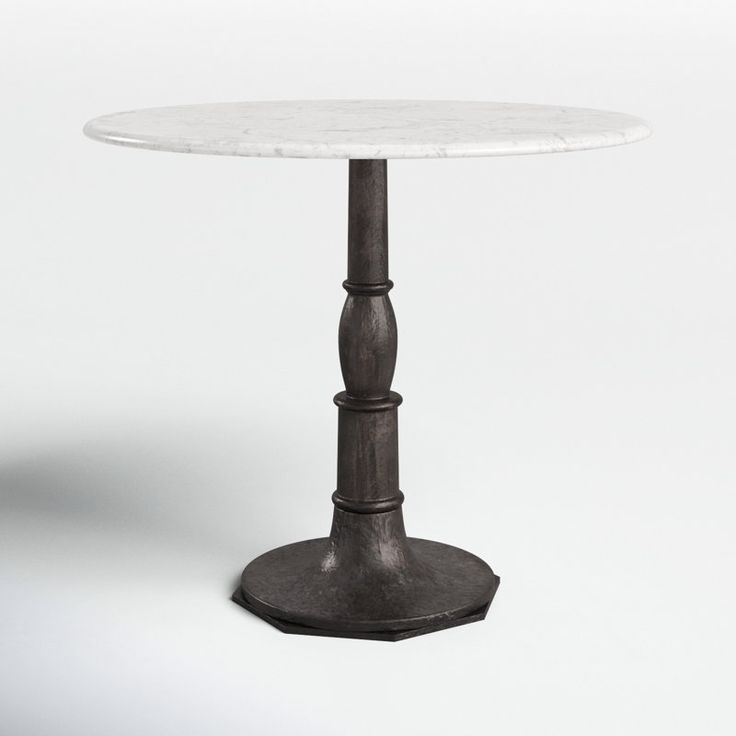 a white marble table sitting on top of a metal base