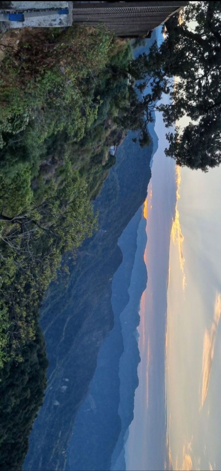 the sky is reflected in the water on the side of the road as it passes by