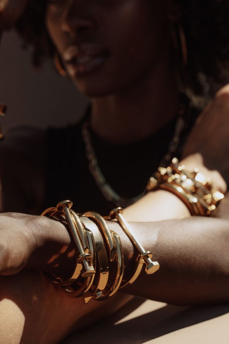 Latch Bracelet - Gold The Reserve Collection was designed by us + is made to last! // Staple pieces that are hypoallergenic, water + tarnish resistant, ultra durable and 18K gold plated stainless steel. // Intended to stack, elevate + stand the test of time. STYLE + FIT NOTES: Add a statement moment to any look with this beauty! // Screw detail that brings an edgy, yet ultra chic vibe! // Let this bracelet do all the talking + plan to wear on repeat. Arm Cuff Jewelry, Hand Candy, Edgy Jewelry, Jewelry Editorial, Cuff Jewelry, Gold Bracelet Cuff, Jewelry Model, Jewelry Photography, The Test