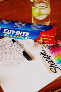 a table with markers, pens, and paper on it that says cutrite wax paper