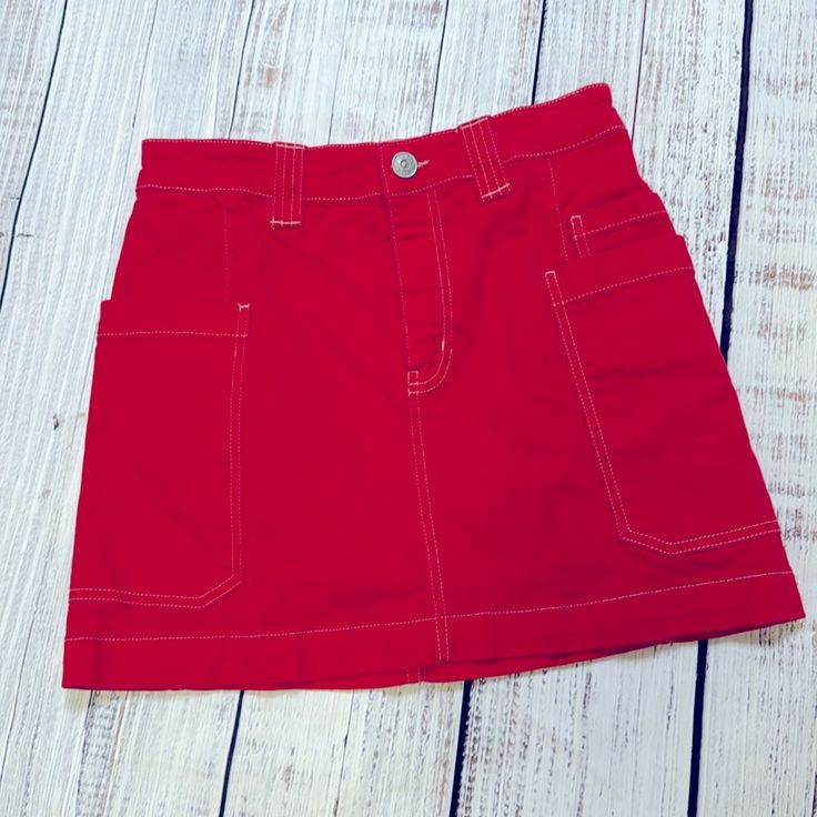 Darling Brand New Condition Red Denim Skirt With Contrast Khaki Stitching From Bdg. Worn Once And Looks Perfect. Waist Is Approx 14” Laid Flat And Length Is Approx 14.5”. So Cute For Summer! Casual Red Denim Skirt, Red Knee-length Mini Skirt For Summer, Casual Red Knee-length Mini Skirt, Red Mini Cotton Skirt, Red Cotton Mini Denim Skirt, Red Denim Skirt, Denim Mini Skirt, Denim Skirt, Womens Skirt