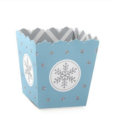 a blue paper box with snowflakes on it