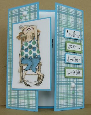 a handmade card with an image of a woman sitting on a chair