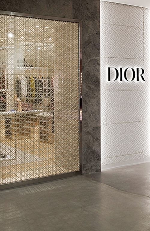 the entrance to dior's new store is shown in front of a large window