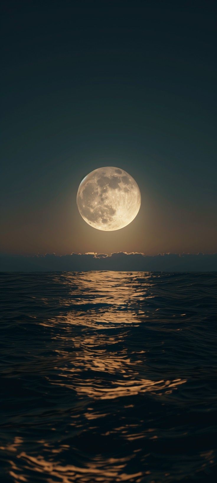 the full moon rising over the ocean at night