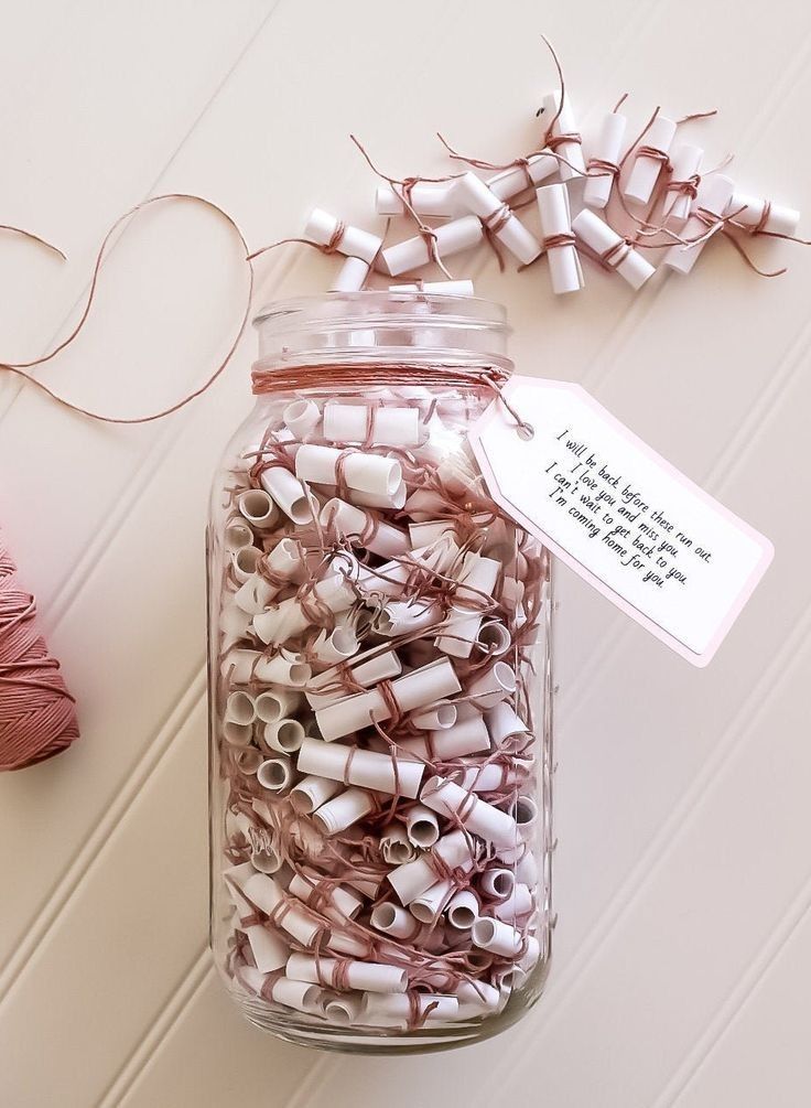 a jar filled with lots of different types of thread