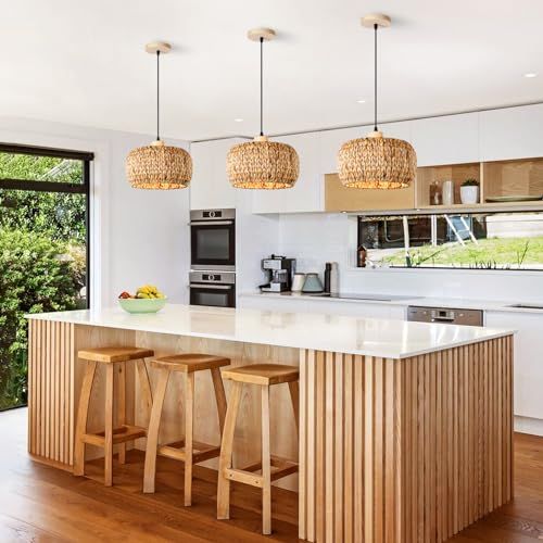 a kitchen with wooden stools and an island