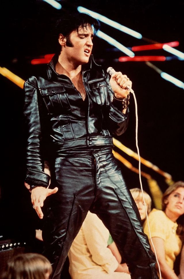 elvis presley performing on stage at an event