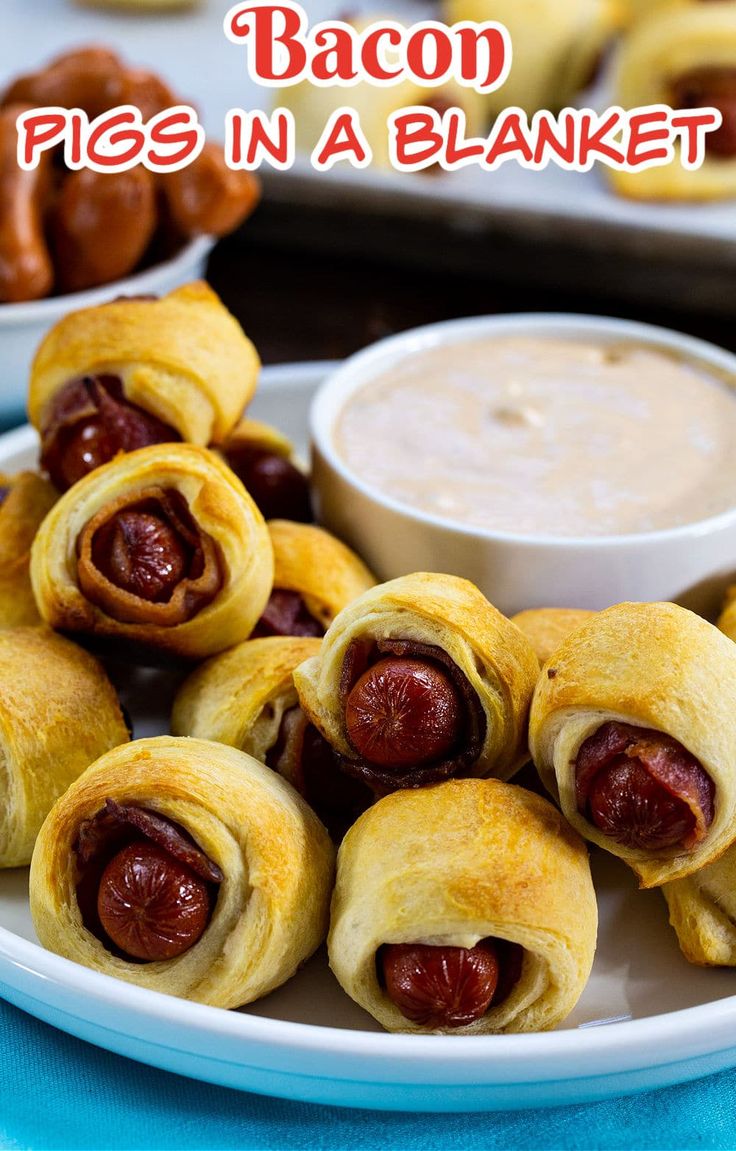 a plate with pigs in a blanket on it