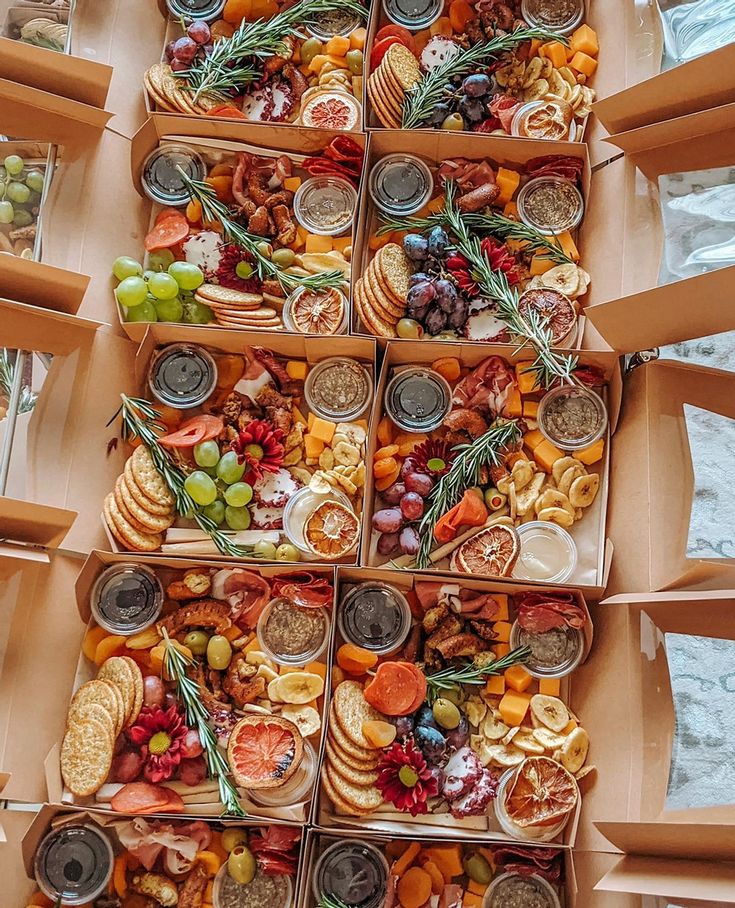 several boxes filled with different types of food