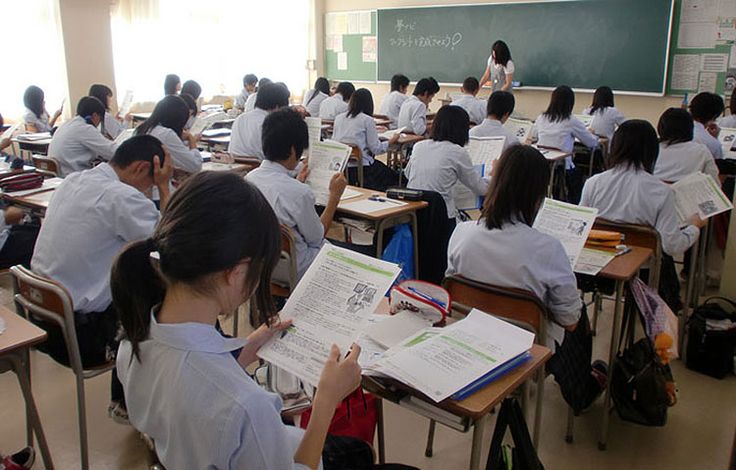 a classroom full of students sitting at desks