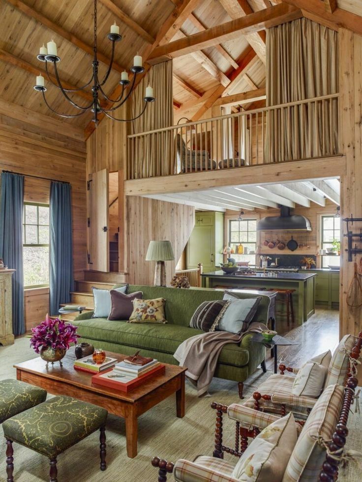 a living room filled with furniture and wooden walls