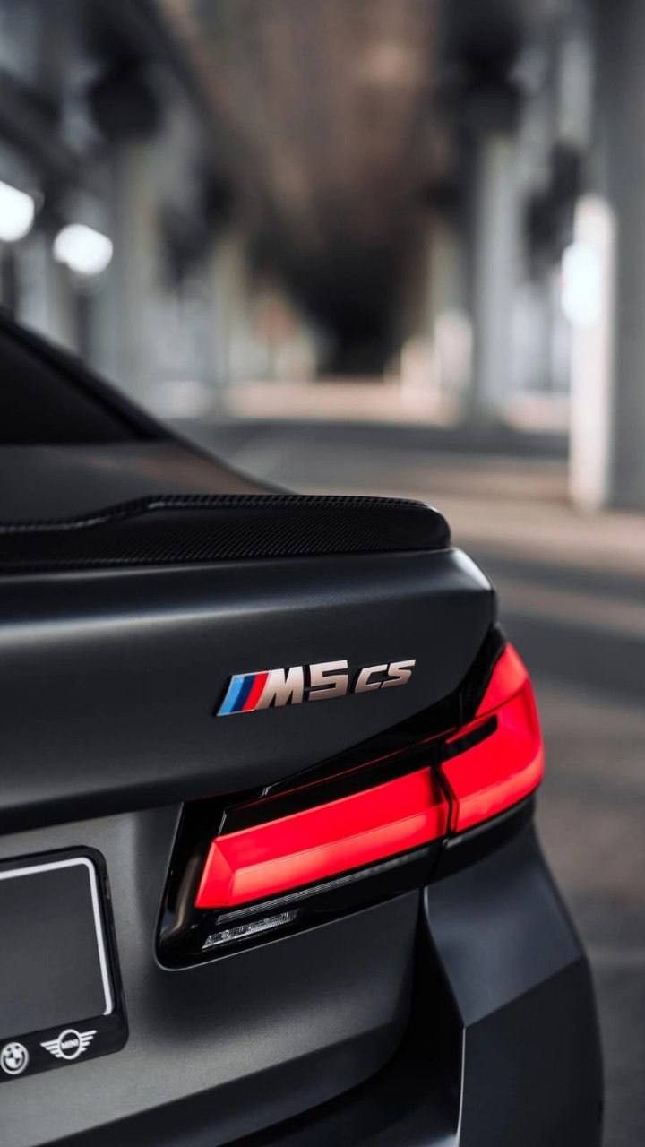 the rear end of a black bmw car