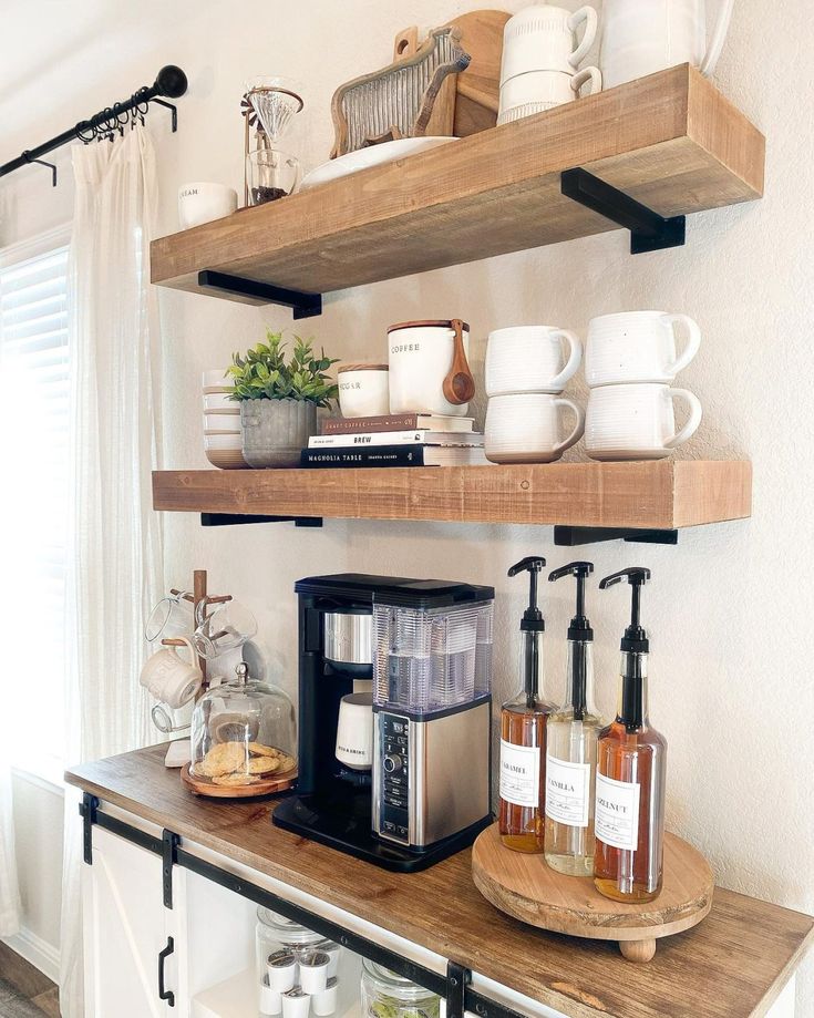 the shelves are filled with coffee, tea and other kitchen items on top of them