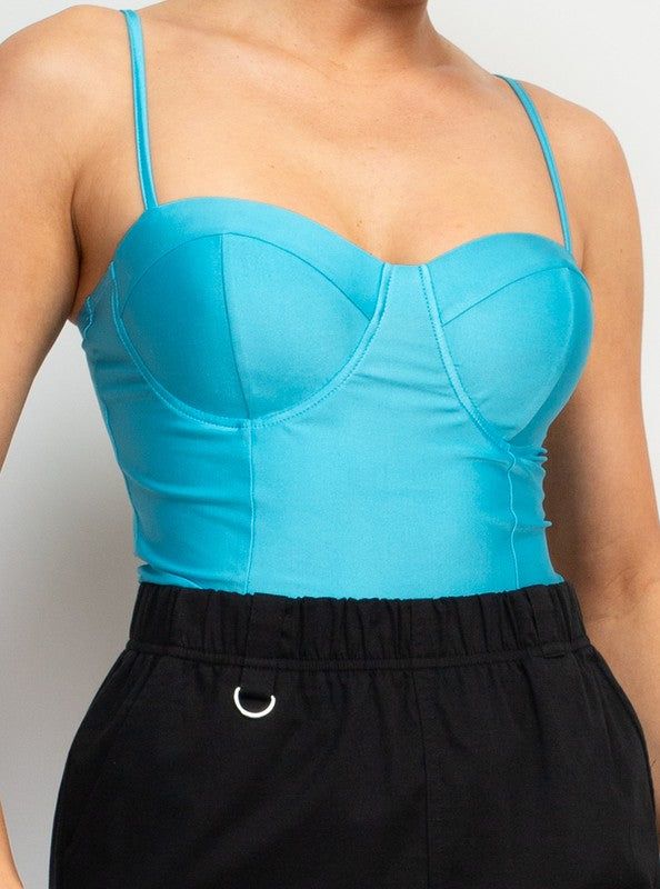 Sweetheart Corset-Like Cami Top Brand: Haute Monde Style: HMT56857 Fabric: 88% POLYESTER, 12% SPANDEX Details: A knit casual glamour top in solid color features a bustier corset-like bodice, sweetheart neckline, adjustable cami straps, and cropped length. Iris Tops Made in Cambodia. Fitted Light Blue Spaghetti Strap Top, Chic Tops With Medium Bust Support, Seamless Crop Top For Parties, Trendy Seamless Party Tops, Trendy Blue Spaghetti Strap Crop Top, Fitted Light Blue Camisole Tank Top, Bra Friendly Cami Top For Party, Bra-friendly Cami Top For Party, Fitted Blue Crop Top With Built-in Bra