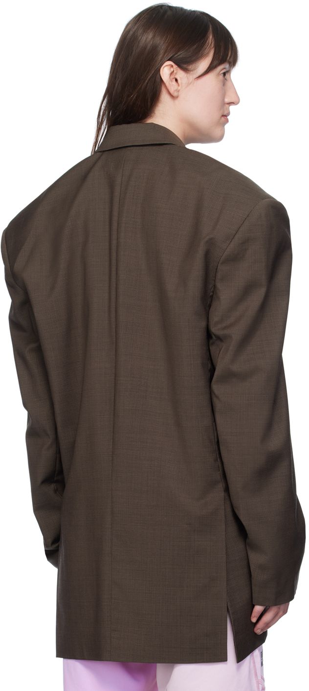 Wool canvas blazer. Houndstooth pattern throughout. · Notched lapel · Button closure · Welt pocket at chest · Flap pockets · Logo patch at front · Vented side seams · Padded shoulders · Welt pocket at interior · Full satin lining Supplier color: Brown houndstooth Brown Business Blazer With Patch Pockets, Brown Blazer With Concealed Placket For Business, Brown Sport Coat With Concealed Placket For Office, Brown Blazer With Patch Pockets For Office, Brown Office Blazer With Patch Pockets, Martine Rose, Rosé Brown, Houndstooth Pattern, Flap Pocket