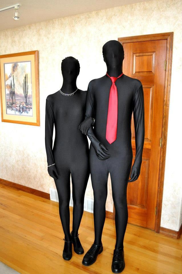 two mannequins dressed in black and red are standing next to each other