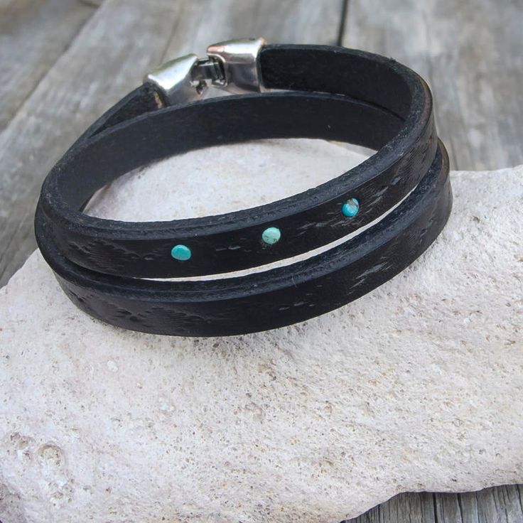 "Made from top quality vegetable tanned leather. Hand painted and stamped leather wrap around bracelet. It is embellished with natural Tibetan Turquoise cabochons. Bangle is 1 cm wide and with zamak clasp closure. Please measure carefully your wrist and select the most preferable size! If you need a diferent size, please let me know after purchase in \"note for seller\". Please visit to my another shop: https://www.etsy.com/shop/JeansBelt?ref=hdr_shop_menu FEDEX to USA and Australia! If you need Southwestern Hand Tooled Leather Bracelets, Turquoise Leather Concho Bracelets, Western Style Turquoise Leather Bracelets, Adjustable Western Leather Bracelet, Southwestern Leather Bracelet For Festival, Southwestern Style Leather Bracelets For Festivals, Rustic Turquoise Leather Bracelet, Adjustable Turquoise Leather Bracelet With Concho, Unique Turquoise Leather Bracelets