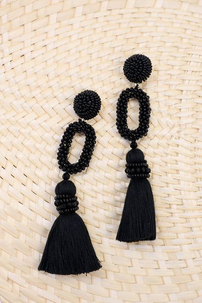 These earrings are all for fun! They are so dramatic and detailed! That beading is so cute and we are so in love with that tassel! These statement earrings will have you ready for any spring or summer vacation! Summer Black Beaded Earrings, Beaded Drop Earrings With Tassels For The Beach, Beaded Tassel Drop Earrings For Beach, Trendy Dangle Beaded Earrings For Vacation, Beach Dangle Earrings With Black Beads, Trendy Beaded Tassel Earrings For Summer, Trendy Summer Beaded Tassel Earrings, Dangle Beaded Fringe Tassel Earrings For Beach, Black Beaded Dangling Earrings For Summer