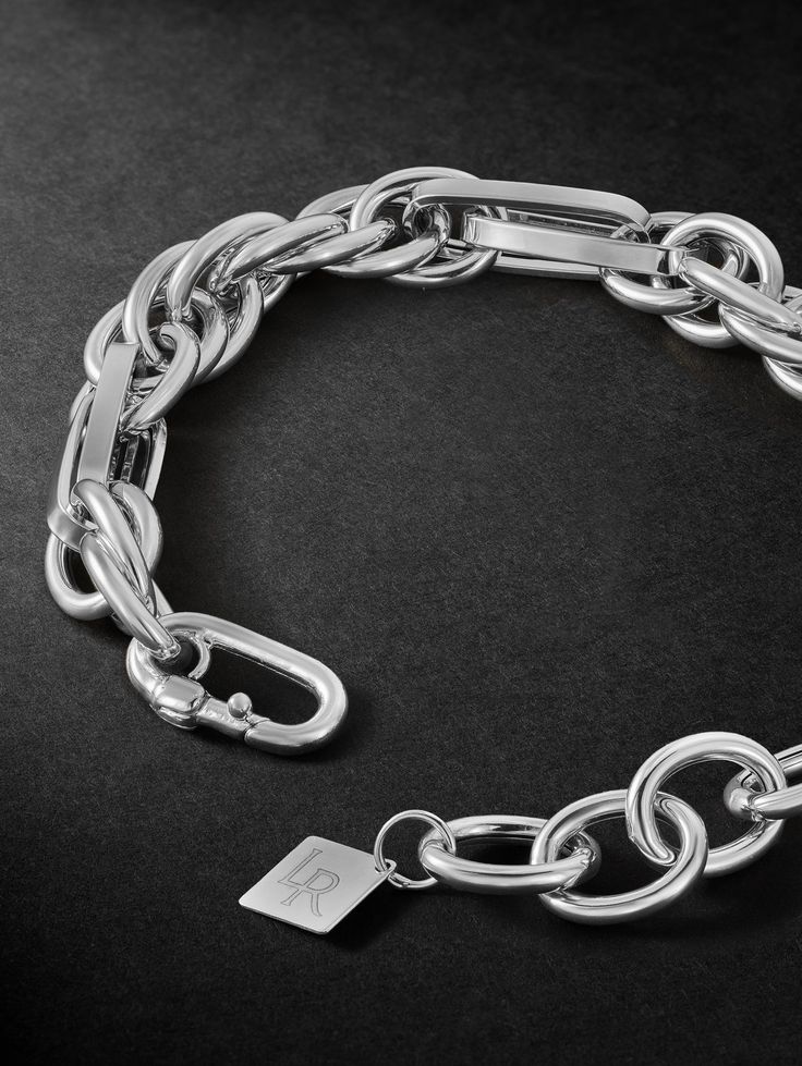 Classic jewellery often serves as a starting point for Lauren Rubinski, which she personalises and modernises through her unique design. This bracelet is cast from white gold using a variety of chain links, creating contrasting shapes and dimensions. It's understated enough to make your everyday signature. Designer Metal Chain Bracelets, Luxury Sterling Silver Link Bracelet With Polished Finish, Designer Chain Link Metal Jewelry, Designer Metal Chain Link Jewelry, Luxury Polished Link Bracelet, Classic White Gold Metal Chain Bracelet, Luxury Polished Platinum Bracelets, Luxury Platinum Bracelets With Polished Finish, Luxury Polished Link Chain Bracelet