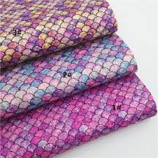 two pieces of fabric with different colors and patterns on them, one is purple and the other is pink