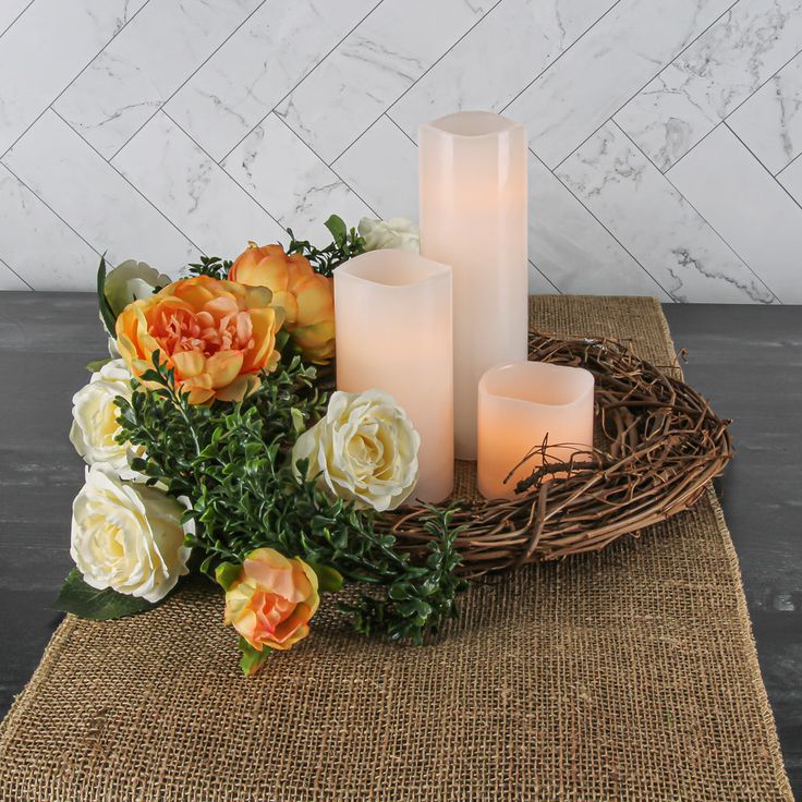 some candles and flowers on a table