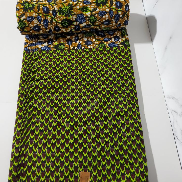 DESCRIPTION Green and Brown Mixed Print African Ankara Fabric. This is high quality African print is 100% cotton and it's 45 inches wide. It is used for making African Clothing, African quilts, & For Home decoration. FYI: Print is Double sided. The listing is for 2yards, 3yards, 6yards and Headwrap Each piece of fabric measures: 70-72in by 45in for 2yards 105-108in by 45in for 3yards 210-216in by 45in for 6yards 70in by 22in for Head wrap If you purchase more than one yard, you will receive one Liberian Fabric, African Inspired Wedding, African Quilts, Clean And Press, Head Wrap Headband, African Ankara, Ankara Fabric, African Inspired, Mixing Fabrics