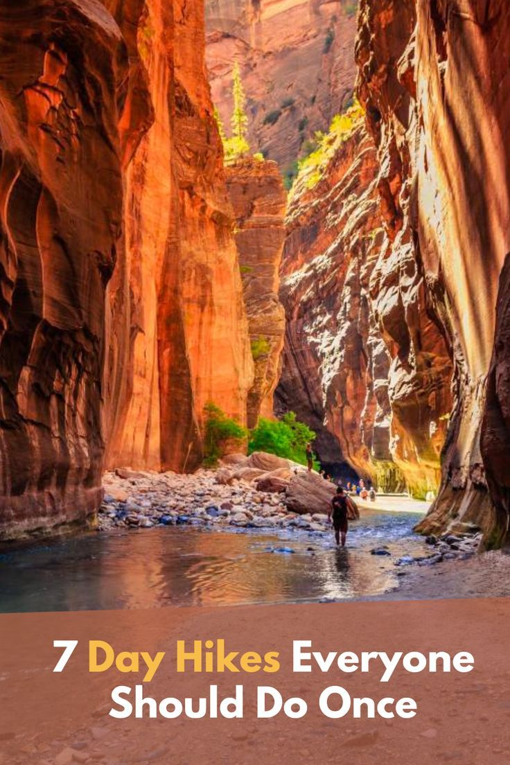 a man wading through a canyon with the words 7 day hikes everyone should do once