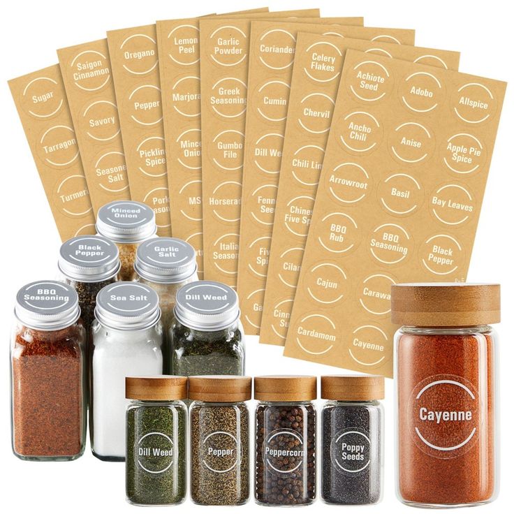 six spices are shown next to each other in glass jars with labels on the side