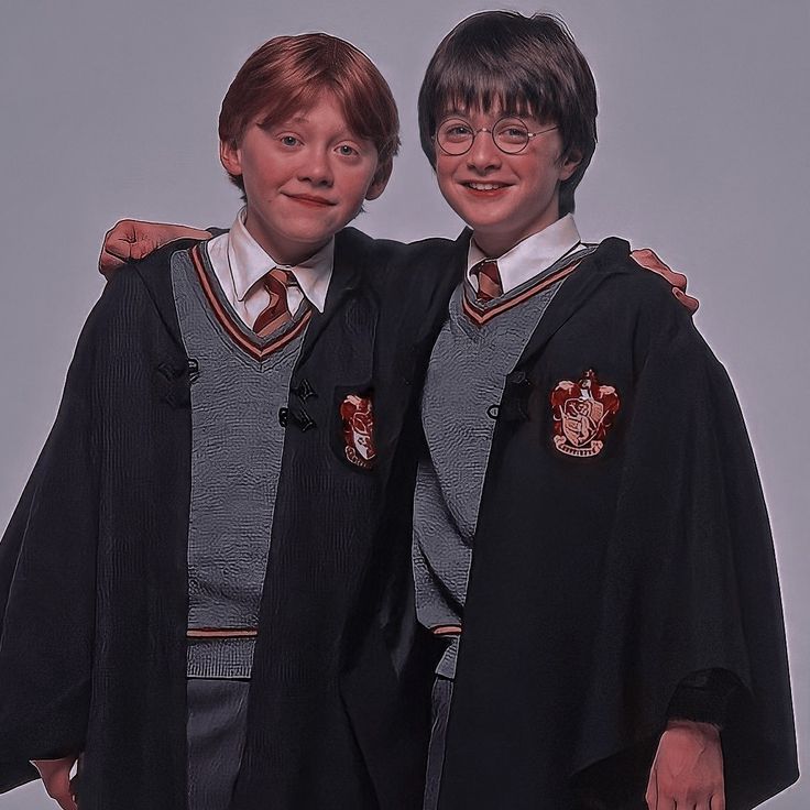 two young men dressed in harry potter outfits