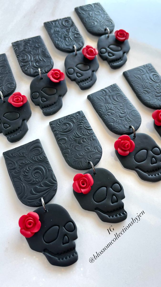 black and red skull earrings with roses on them