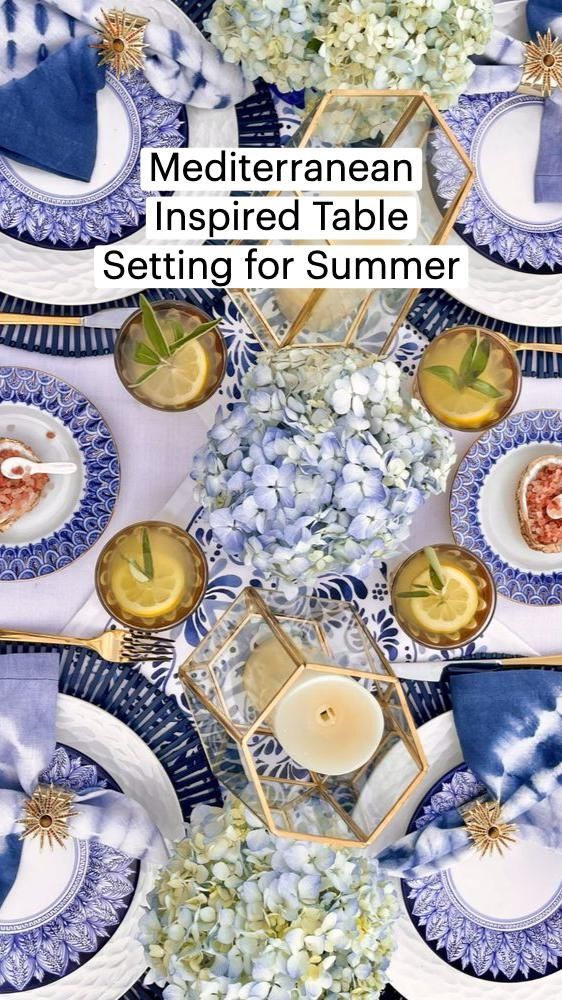 the cover of mediterranean inspired table setting for summer, featuring blue and white plates with gold accents