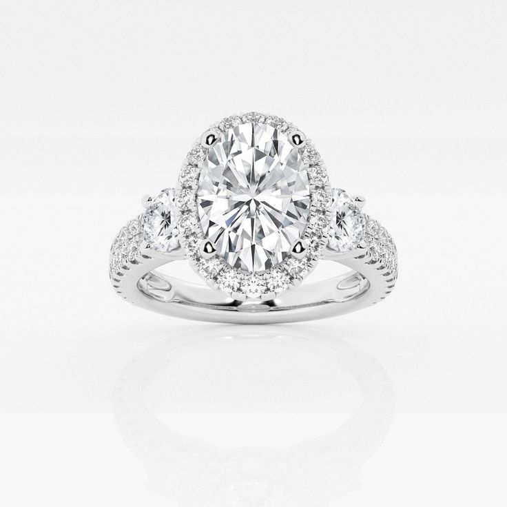 a round cut diamond ring with pave set diamonds on the band and halo setting