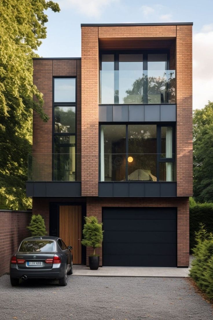 a car parked in front of a tall brick building with lots of windows and doors